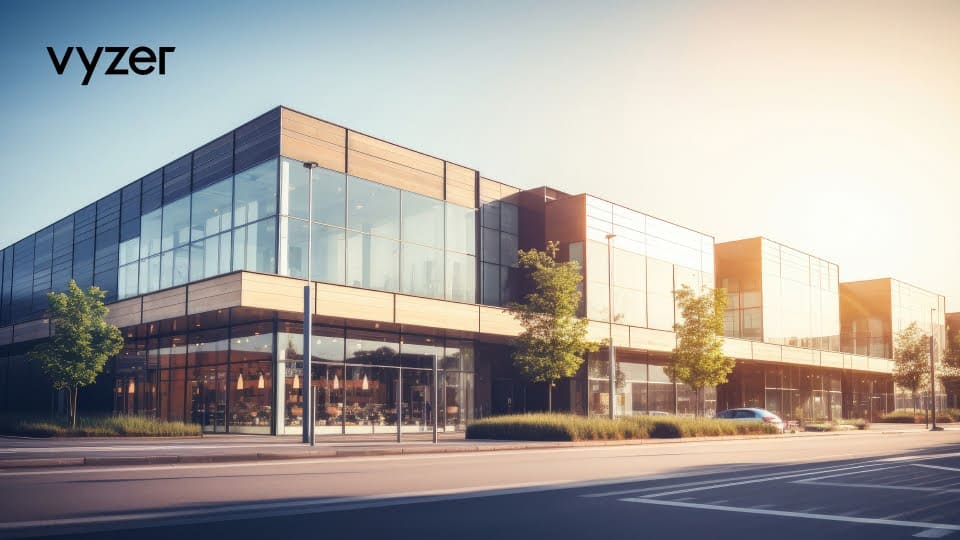Modern glass architecture of corporate headquarters in downtown, depicting emerging commercial real estate hotspots in 2024, set against an urban cityscape and blue sky.
